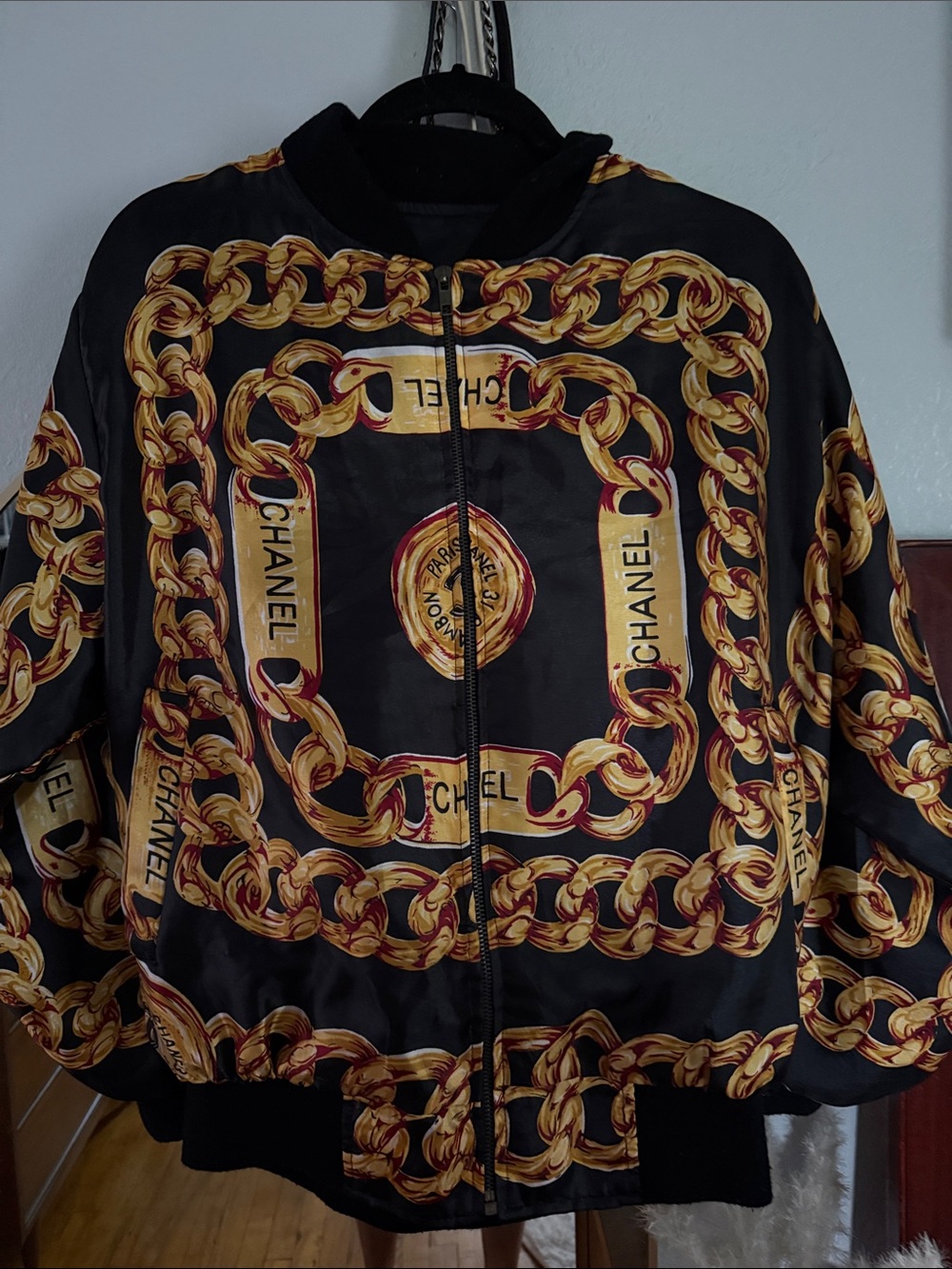 CHANEL Black Bomber Jacket with Gold Chain Print